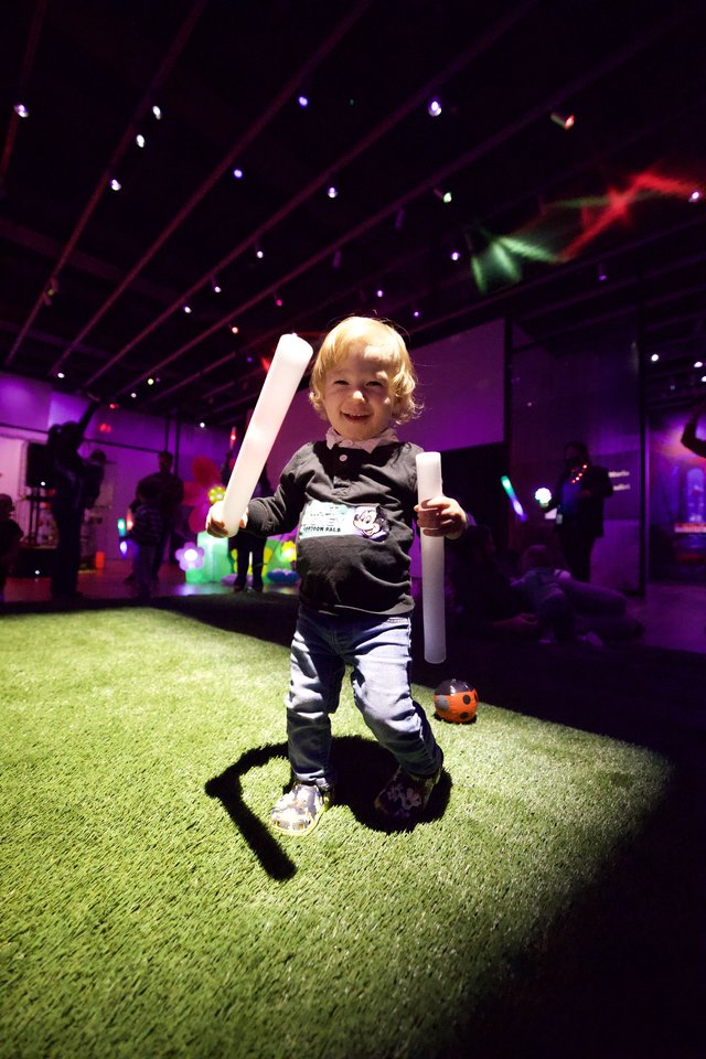 Toddler with Glow Sticks at Baby Rave Event