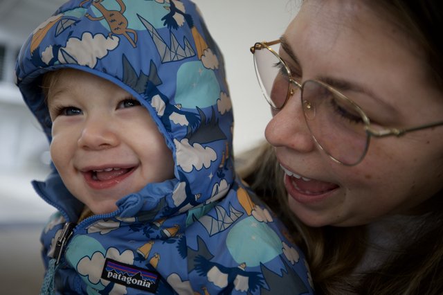 Joyful Winter Moment: Parent and Child Smiling Together