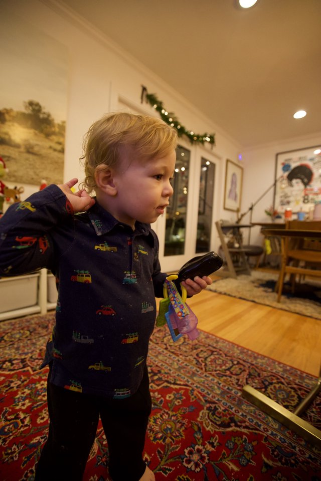Toddler on Christmas Morning with Remote Control