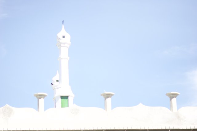 White Mosque Tower Reaching for the Blue Skies