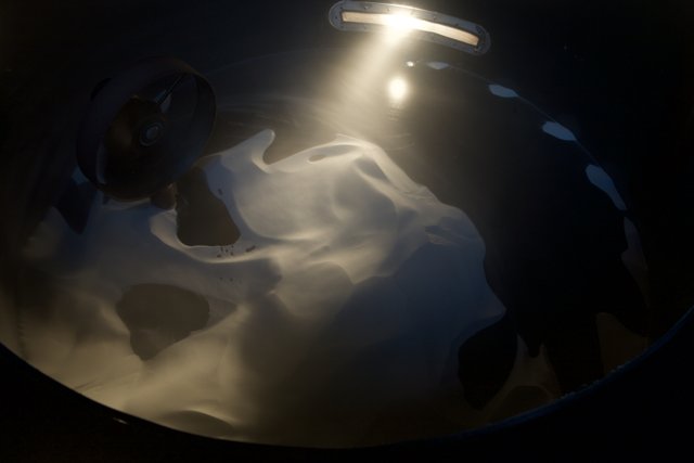 Illuminated White Liquid in a Bowl