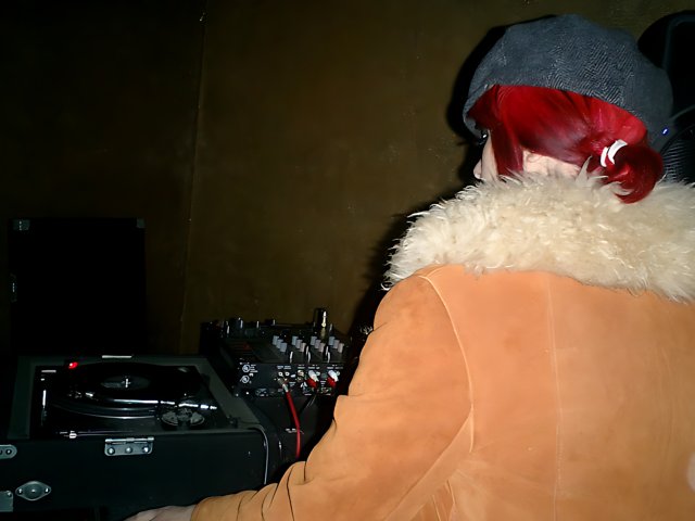 Red-Haired Woman Rocks DJ Set on New Year's Eve