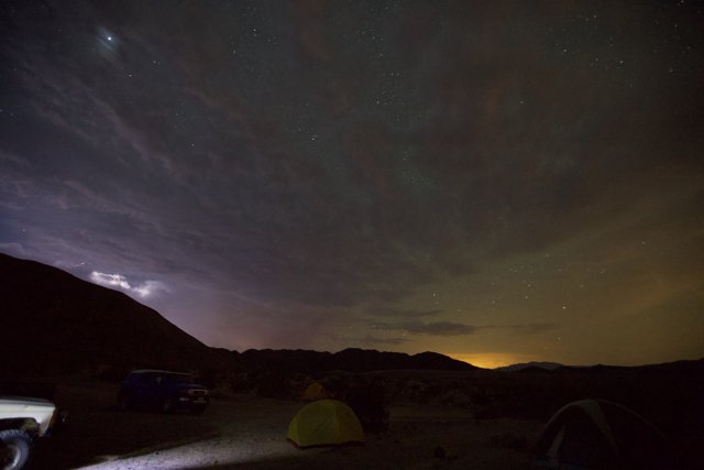 Camping under the stars during a lightning storm