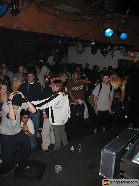 Nightclub Crowd Hypnotized by DJ's Beats
