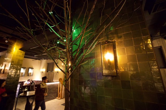 Artistic Branch Installation in Intimate Restaurant Setting