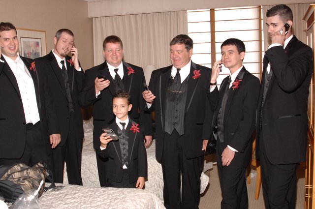 Groomsmen Checking Phones Before Wedding Ceremony