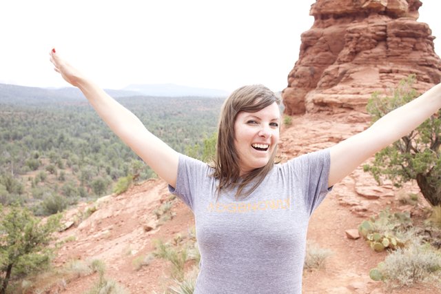 Joyful Hiker Celebrates Atop Sedona Red Rock