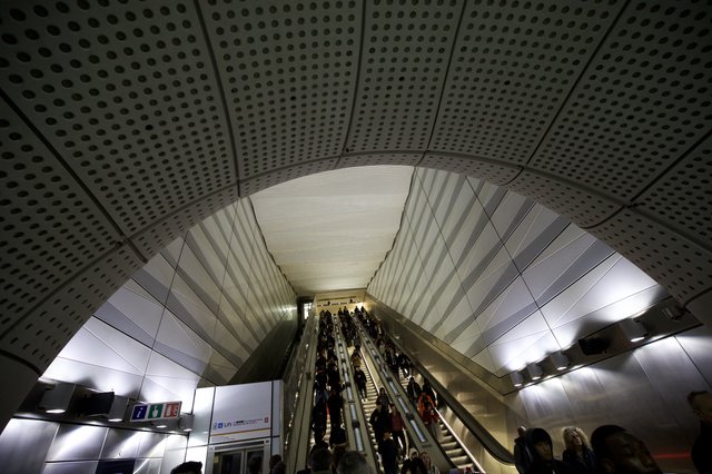 Modern Metro Station Escalators with Commuters