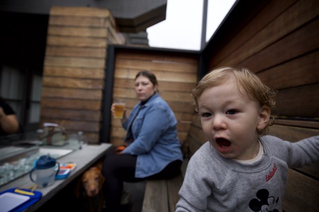 Excited Toddler's Animated Expression in Modern Kitchen