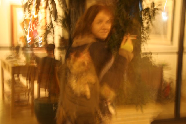 Blurry Snapshot of a Woman and Her Feline Companion