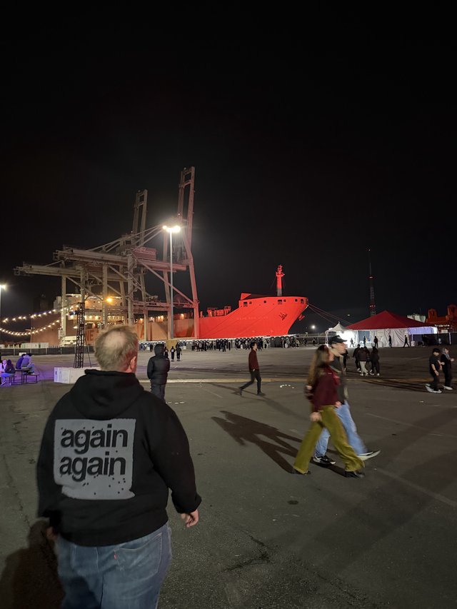 Industrial Port Night Scene with Cargo Ship and Cranes