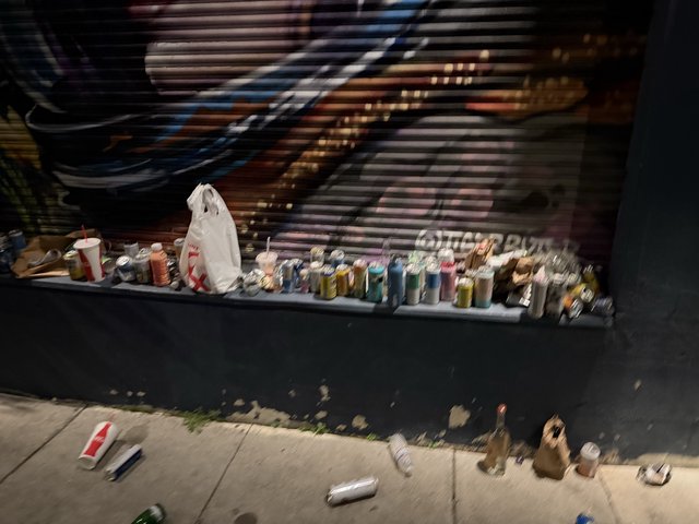 Street Tailor's Colorful Thread Collection at Night