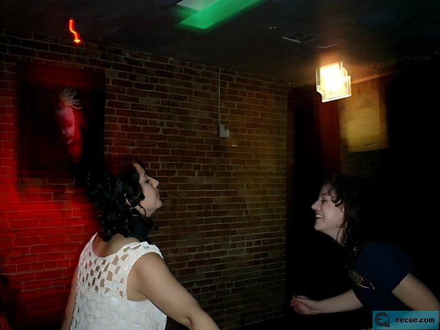 Spotlight on Two Women Dancing in a Nightclub