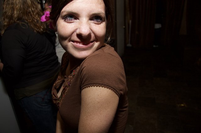 Smiling Woman with Pink Flower at Art Walk