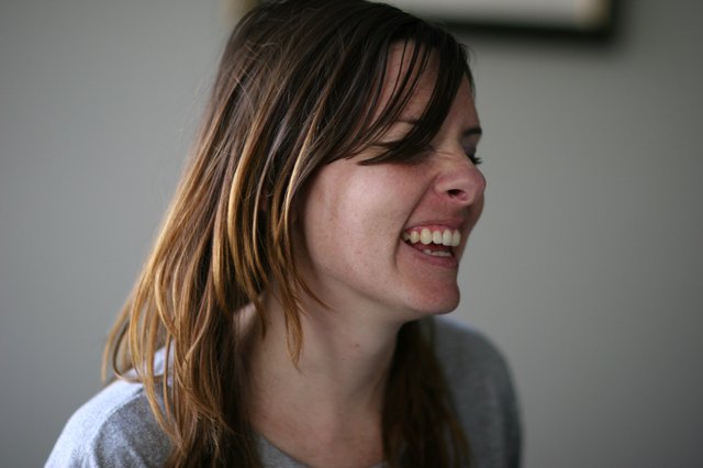 Candid Laughter: Woman with Sun-Kissed Hair