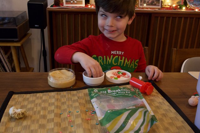 Child Playing with Elf Breakfast Play Dough Kit at Christmas