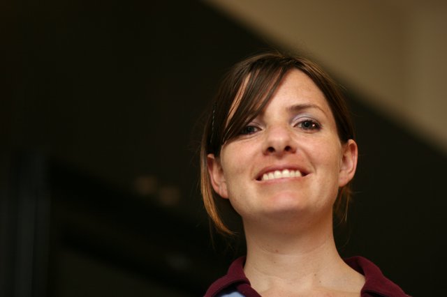 Candid Portrait of a Smiling Young Woman Indoors