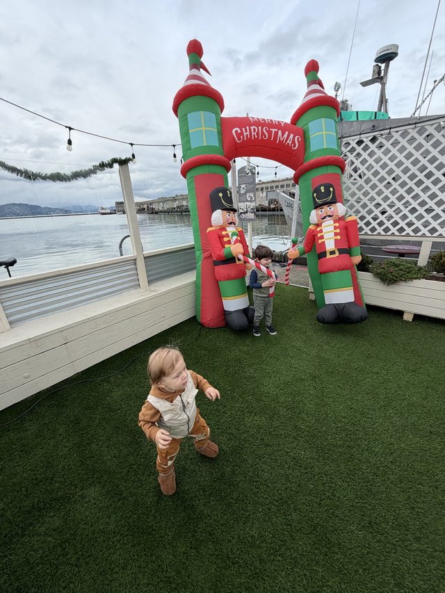 Children Playing at Waterfront Christmas Display
