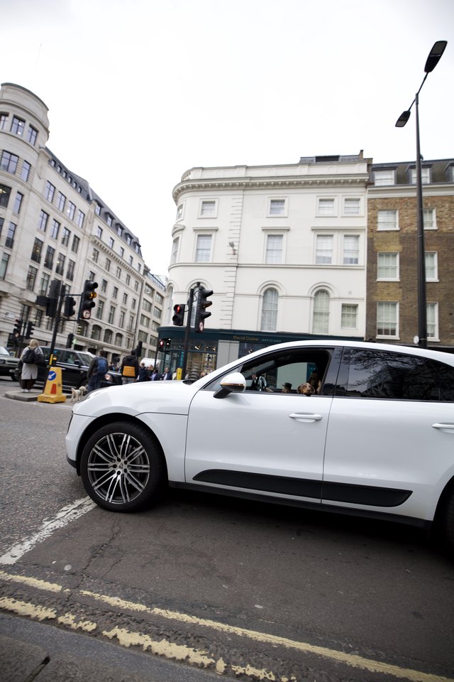 White Luxury Car on London Street Corner