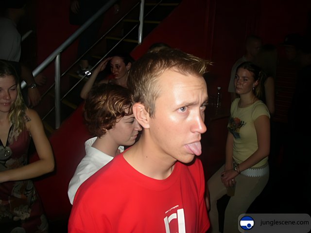 Tounge-out Teen at Nightclub Premiere