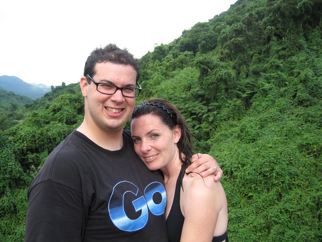 Couple Smiling Against Lush Fiji Jungle Hillside