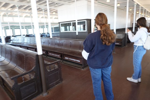 Museum Visitors Viewing Historic Train Car Display