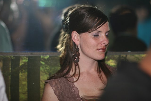 Pensive Woman at Evening Social Gathering