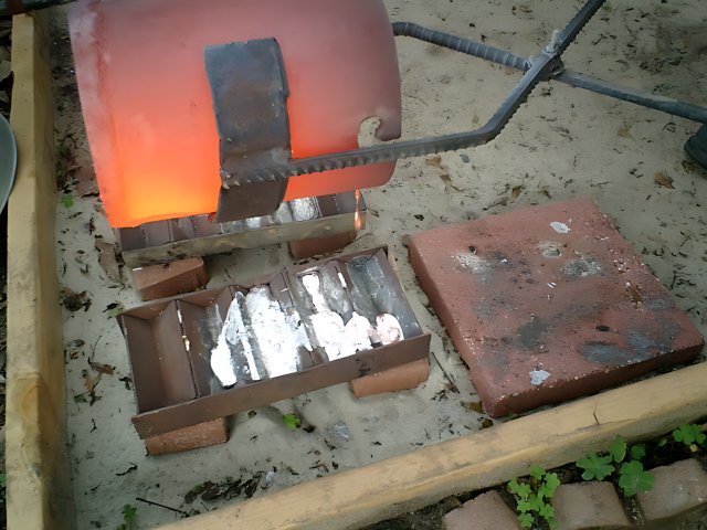 Metal forging on a brick