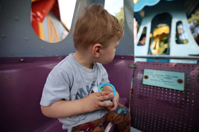 Young Boy at Fantasyland Amusement Park Ride