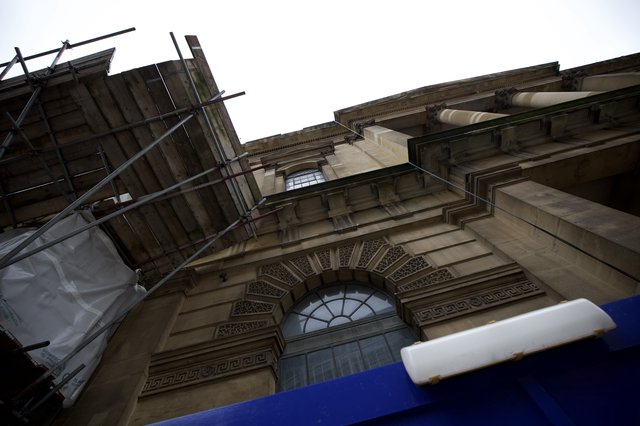 Upward View of Classical Stone Architecture Under Renovation