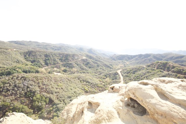 Cliffside View of Majestic Mountain Range