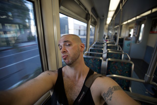 Tattooed Man on Train