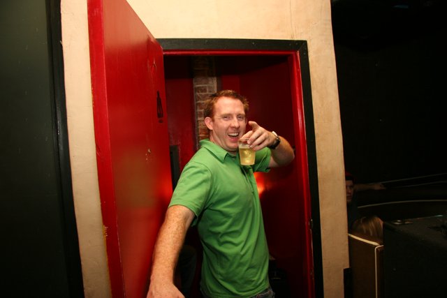 Green Shirt Guy Enjoys a Pint at the Pub