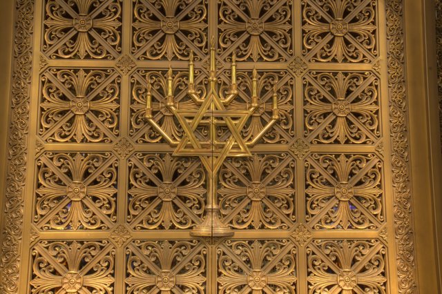 Gold Menorah Displayed in Sacred Building