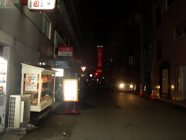 Nighttime Scene of a Busy City Street