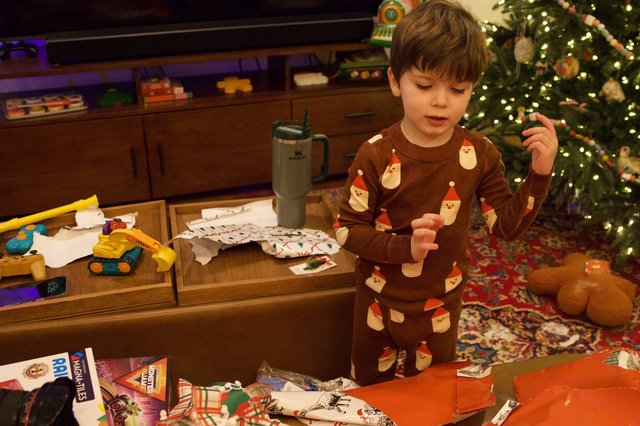 Christmas Morning Gift Opening in Festive Pajamas
