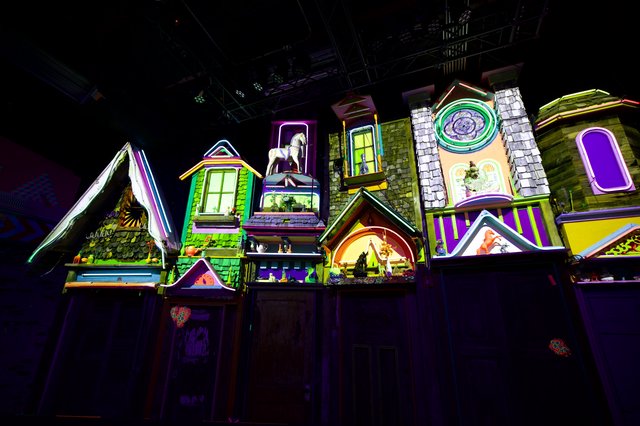 Whimsical Illuminated Village Display with Neon Colors