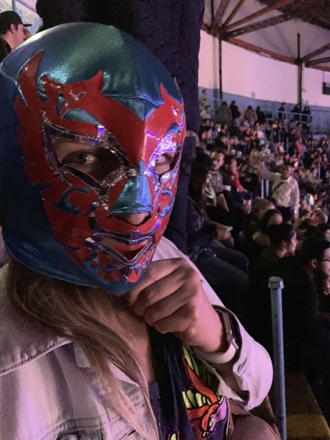 Masked Woman in the Wrestling Crowd