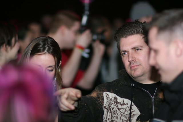 Pink-haired Man in Black Jacket at Nightclub