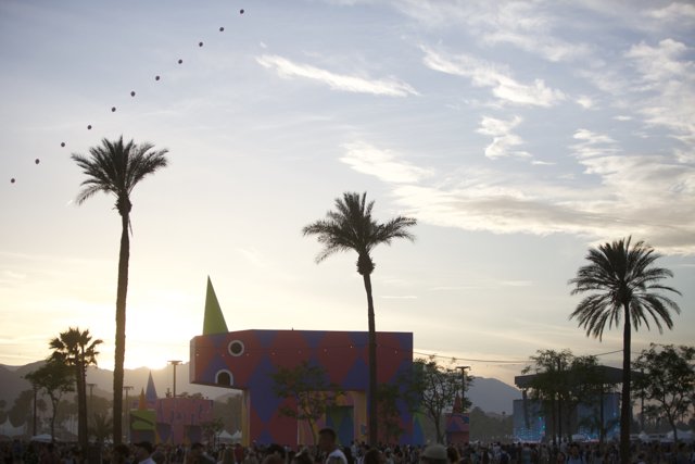 Colorful Building and Palm Trees with Kite Flying