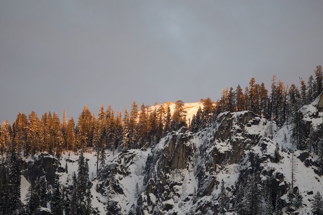 Golden Hour Illuminating Snow-Covered Yosemite Cliffs
