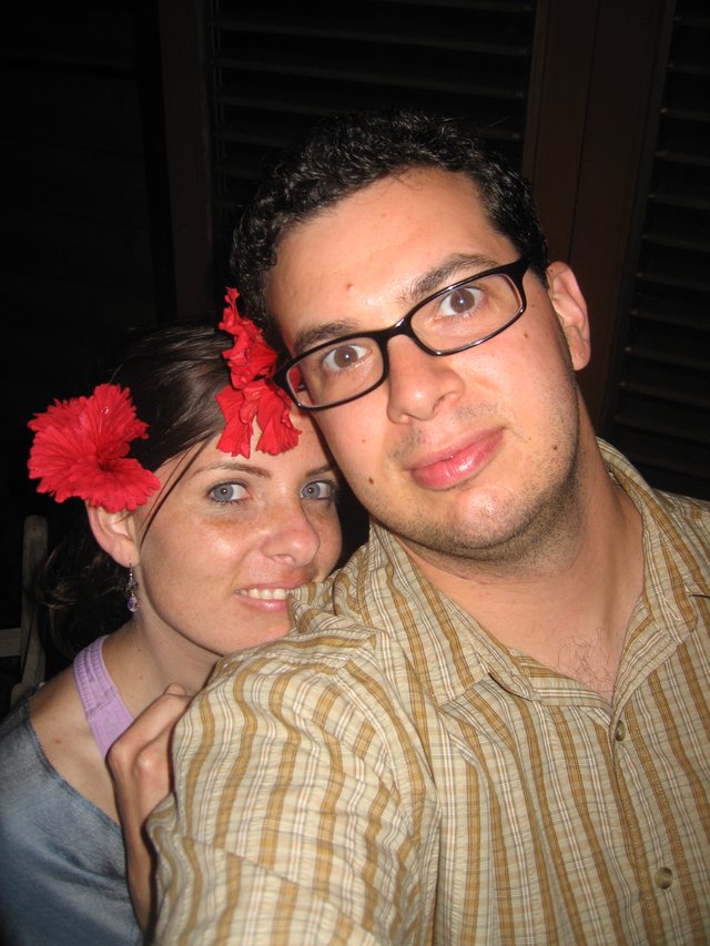 Couple Poses Together at Tropical Evening Gathering