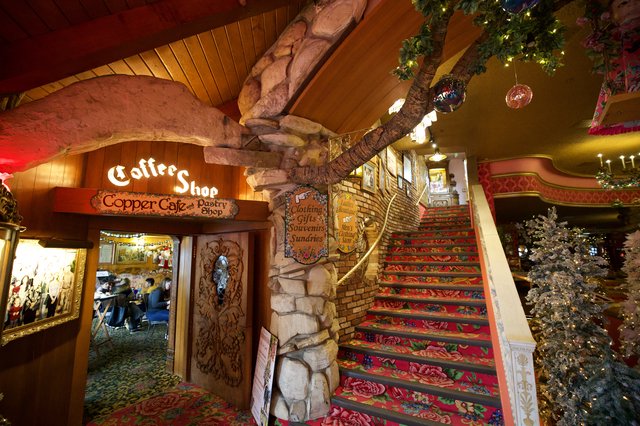 Whimsical Coffee Shop with Vibrant Floral Staircase