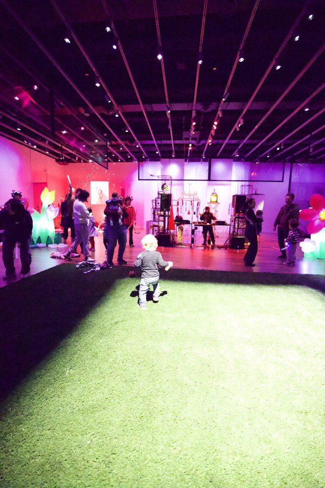 Child Playing at Vibrant Baby Rave Exhibition