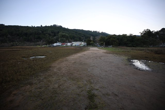 Tidal Flats at Drakes Beach with Coastal Settlement