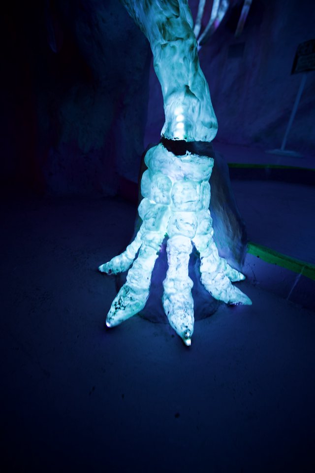 Taloned Ice Sculpture Under Blue Ethereal Lighting