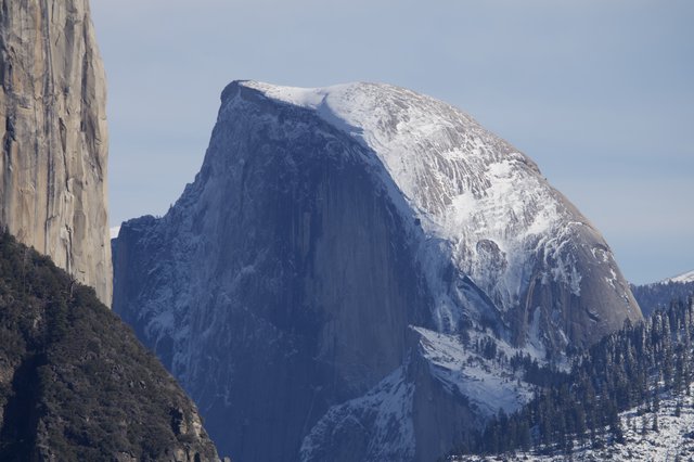 Half Dome's Snow-Covered Granite Face in Winter