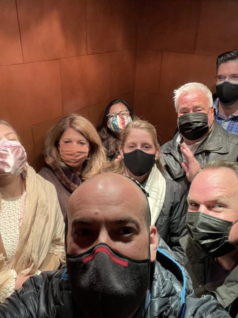 Masked Elevator Ride