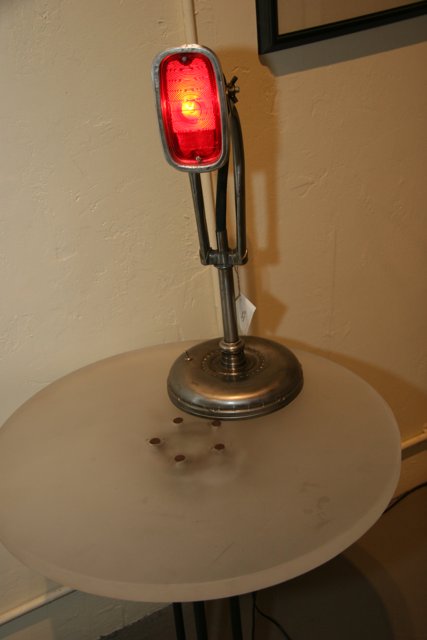 The Red Lamp on the Wooden Table