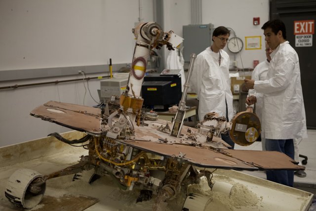 Two Men in White Coats at JPL Factory